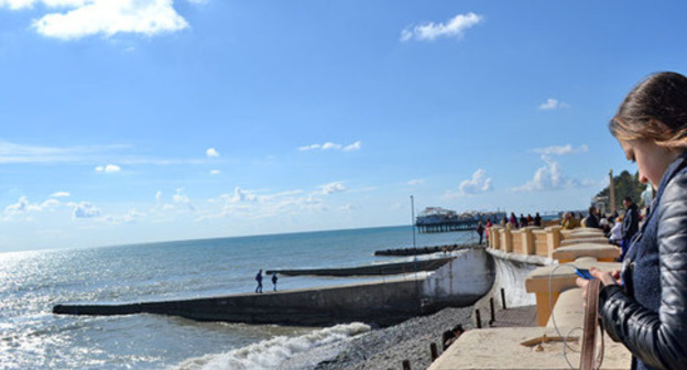 Tourists on the beach in Sochi. Photo by Svetlana Kravchenko for the Tourists on the beach in Sochi. Photo by Svetlana Kravchenko for the