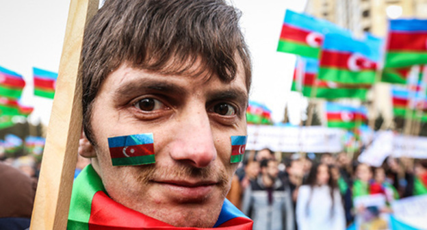 A participant of the protest action in Baku. Photo by Aziz Karimov for the "Caucasian Knot" A participant of the protest action in Baku. Photo by Aziz Karimov for the "Caucasian Knot"
