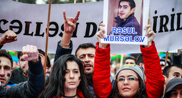 Rally participants hold portrait of political prisoner, Baku, March 2015. Photo by Aziz Karimov for the ‘Caucasian Knot’. Rally participants hold portrait of political prisoner, Baku, March 2015. Photo by Aziz Karimov for the ‘Caucasian Knot’.