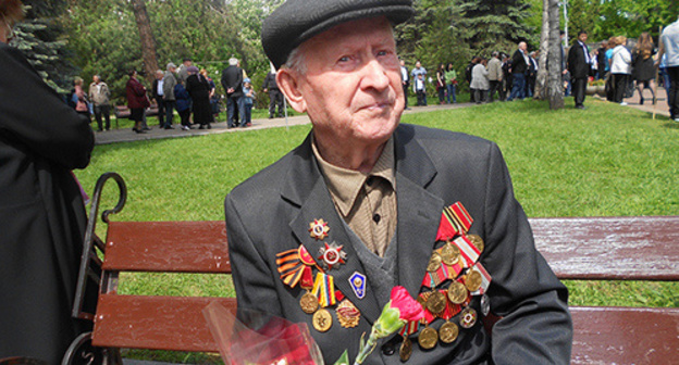 Participant of May 9 festive events. Photo by Lyudmila Orazaeva for the 'Caucasian Knot'. Participant of May 9 festive events. Photo by Lyudmila Orazaeva for the 'Caucasian Knot'.