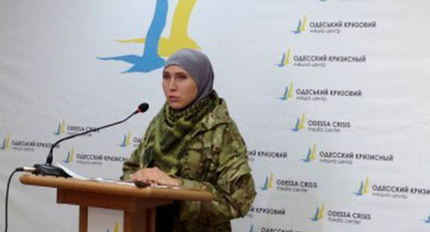 Amina Okueva. Screenshot of a video "Isa Munaev and Amina Okueva", http://www.youtube.com/watch?v=L54NTpenCkM Amina Okueva. Screenshot of a video "Isa Munaev and Amina Okueva", http://www.youtube.com/watch?v=L54NTpenCkM