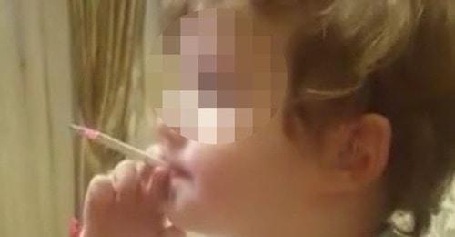 Screenshot of a video with a smoking child. Photo https://www.facebook.com/groups/respublikaalania/permalink/197991943232979 Screenshot of a video with a smoking child. Photo https://www.facebook.com/groups/respublikaalania/permalink/197991943232979