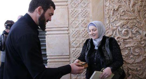 Magomed Daudov, the speaker of the Chechen parliament, gives the Order of Fatherland's Honour to Medni Kadyrova. Photo http://www.parlamentchr.ru/press-centre/news/6758-m-daudov-vruchil-ajmani-i-medni-kadyrovym-vysshie-nagrady-parlamenta-chr Magomed Daudov, the speaker of the Chechen parliament, gives the Order of Fatherland's Honour to Medni Kadyrova. Photo http://www.parlamentchr.ru/press-centre/news/6758-m-daudov-vruchil-ajmani-i-medni-kadyrovym-vysshie-nagrady-parlamenta-chr