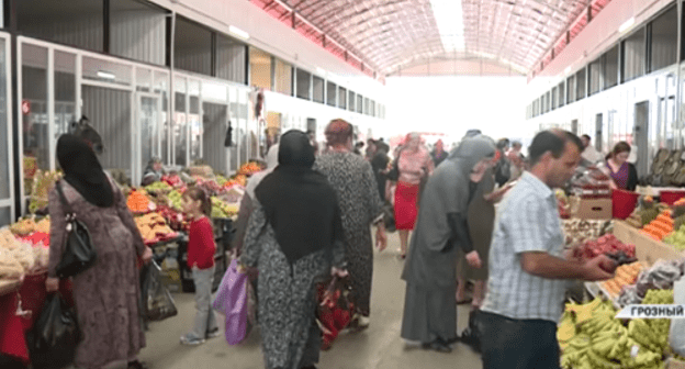 Grozny resident at a food market on the eve of Eid al-Fitr. Screenshot of 'Grozny' TV Channel footage: https://www.youtube.com/watch?v=W39ZdVcGX0I Grozny resident at a food market on the eve of Eid al-Fitr. Screenshot of 'Grozny' TV Channel footage: https://www.youtube.com/watch?v=W39ZdVcGX0I