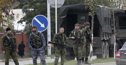 Law enforcers. Photo: REUTERS/Alkhan Gargayev Law enforcers. Photo: REUTERS/Alkhan Gargayev