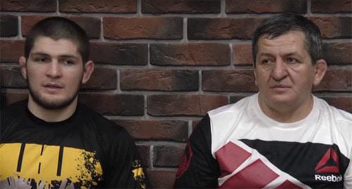 Khabib and Abdulmanap (right) Nurmagomedov. Photo: Vremya Sporta https://www.youtube.com/watch?v=HWyclHTd89o https://ru.wikipedia.org Khabib and Abdulmanap (right) Nurmagomedov. Photo: Vremya Sporta https://www.youtube.com/watch?v=HWyclHTd89o https://ru.wikipedia.org