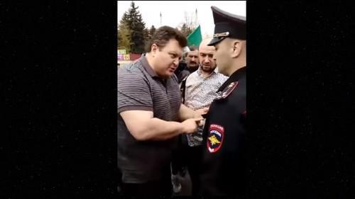 Screenshot of dispute between activist and law enforcers in Nalchik on the Circassian Flag Day, April 25, 2019, https://www.youtube.com/watch?v=S1XrPZXijI4&t=199s Screenshot of dispute between activist and law enforcers in Nalchik on the Circassian Flag Day, April 25, 2019, https://www.youtube.com/watch?v=S1XrPZXijI4&t=199s