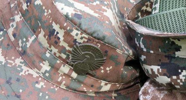 A cap badge of the Karabakh army soldier. Photo by Alvard Grigoryan for the "Caucasian Knot" A cap badge of the Karabakh army soldier. Photo by Alvard Grigoryan for the "Caucasian Knot"