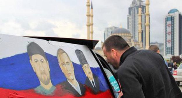 A car with portraits of Russian and Chechen leaders. Photo by Magomed Magomedov for the Caucasian Knot A car with portraits of Russian and Chechen leaders. Photo by Magomed Magomedov for the Caucasian Knot
