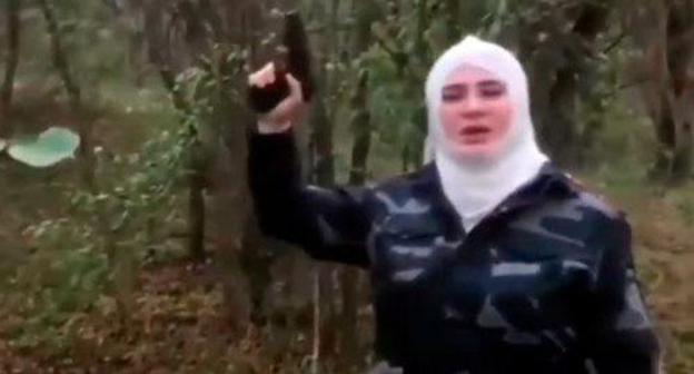 Resident of North Ossetia holding pistol. Screenshot from video posted by 'Chechnya Segodnya' at https://www.youtube.com/watch?time_continue=10&v=nOp1_XDAsSo Resident of North Ossetia holding pistol. Screenshot from video posted by 'Chechnya Segodnya' at https://www.youtube.com/watch?time_continue=10&v=nOp1_XDAsSo