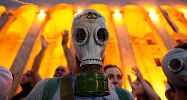 Participant of a protest rally in Tbilisi, June 22, 2019. Photo: REUTERS/Irakli Gedenidze images of the DAY Participant of a protest rally in Tbilisi, June 22, 2019. Photo: REUTERS/Irakli Gedenidze images of the DAY