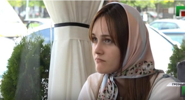 TV story about Chechen girl taken out of Moscow to Chechnya. Screenshot from ‘Grozny’ TV Company broadcasting, http://www.youtube.com/watch?time_continue=1&v=JqgMCSFfTF4 TV story about Chechen girl taken out of Moscow to Chechnya. Screenshot from ‘Grozny’ TV Company broadcasting, http://www.youtube.com/watch?time_continue=1&v=JqgMCSFfTF4