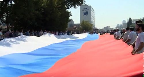 Celebration of the Day of the National Flag of Russia in Chechnya. Screenshot from video by 'Grozny' TV Company Celebration of the Day of the National Flag of Russia in Chechnya. Screenshot from video by 'Grozny' TV Company