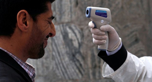 Temperature screening. Photo: REUTERS/Mohammad Ismail Temperature screening. Photo: REUTERS/Mohammad Ismail