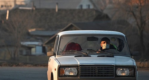 A car driver in a face mask, Russia, March 2020. Photo: REUTERS/Alexey Malgavko A car driver in a face mask, Russia, March 2020. Photo: REUTERS/Alexey Malgavko
