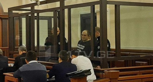 Giorgi Rurua in the courtroom. Screenshot from video posted by TV Channel 1tv: https://1tv.ge/ru/news/sud-ostavil-georgija-rurua-v-zakljuchenii/ Giorgi Rurua in the courtroom. Screenshot from video posted by TV Channel 1tv: https://1tv.ge/ru/news/sud-ostavil-georgija-rurua-v-zakljuchenii/