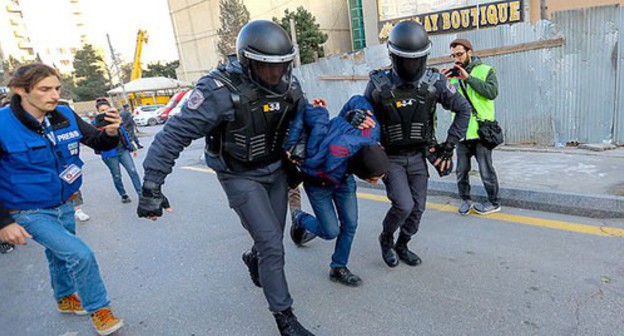 Law enforcers detain a rally participant, February 16, 2020. Photo by Aziz Karimov for the Caucasian Knot Law enforcers detain a rally participant, February 16, 2020. Photo by Aziz Karimov for the Caucasian Knot