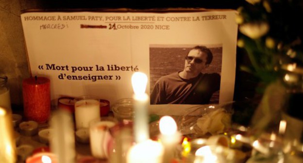 Improvised memorial where people pay tribute to Samuel Paty, the French teacher who was beheaded on the streets of the Paris suburb of Conflans-Sainte-Honorine, France, October 21, 2020. Photo: REUTERS/Eric Gaillard Improvised memorial where people pay tribute to Samuel Paty, the French teacher who was beheaded on the streets of the Paris suburb of Conflans-Sainte-Honorine, France, October 21, 2020. Photo: REUTERS/Eric Gaillard