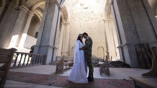 The wedding ceremony of Mariam Sargsyan, a resident of Martuni, and Ovik Ovsepyan, a volunteer of the Defence Army, in the partially destroyed Kazanchetsots Cathedral in the city of Shushi. October 24, 2020. Photo by David Gakhramanyan. Karabakh Information Centre, https://www.facebook.com/ArtsakhInformation/photos/a.104748431165946/200467334927388/?__tn__=%2CO*F The wedding ceremony of Mariam Sargsyan, a resident of Martuni, and Ovik Ovsepyan, a volunteer of the Defence Army, in the partially destroyed Kazanchetsots Cathedral in the city of Shushi. October 24, 2020. Photo by David Gakhramanyan. Karabakh Information Centre, https://www.facebook.com/ArtsakhInformation/photos/a.104748431165946/200467334927388/?__tn__=%2CO*F