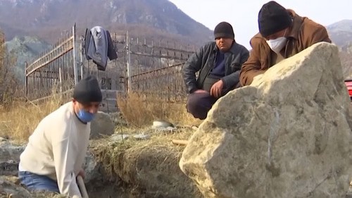 Residents of Karvachar dig up the remains of their relatives from the graves. Screenshot of the video by the "Sputnik Armenia" www.youtube.com/watch?v=jEdDZOTPViE&feature=emb_log Residents of Karvachar dig up the remains of their relatives from the graves. Screenshot of the video by the "Sputnik Armenia" www.youtube.com/watch?v=jEdDZOTPViE&feature=emb_log