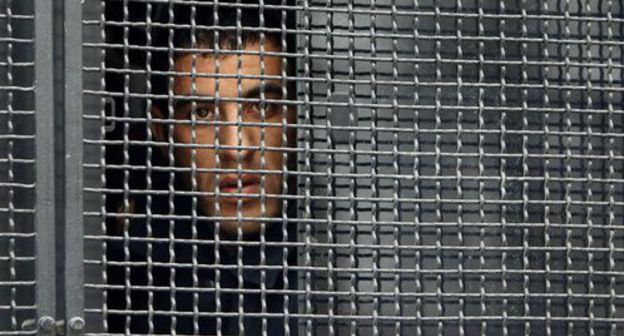 A detained activist in a police car. Photo: REUTERS/David Mdzinarishvili A detained activist in a police car. Photo: REUTERS/David Mdzinarishvili