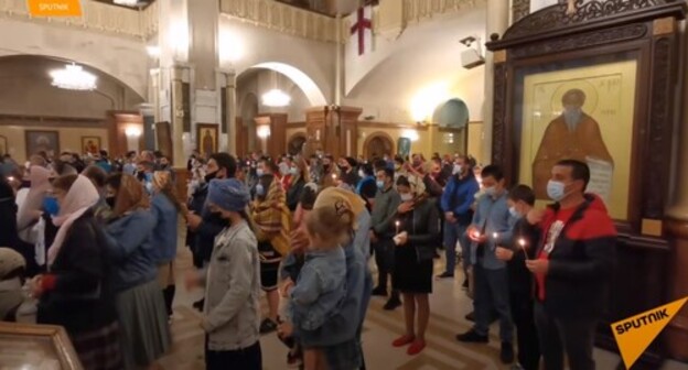Believers during the Easter services held at the Holy Trinity Cathedral of Tbilisi commonly known as Sameba, May 2, 2021. Screenshot of the video on the "Sputnik Georgia - все о Грузии" YouTube channel https://www.youtube.com/watch?v=_NzI5XOJFjY Believers during the Easter services held at the Holy Trinity Cathedral of Tbilisi commonly known as Sameba, May 2, 2021. Screenshot of the video on the "Sputnik Georgia - все о Грузии" YouTube channel https://www.youtube.com/watch?v=_NzI5XOJFjY