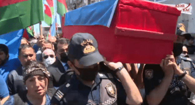 The funeral of the journalist Magerram Ibragimov in Azerbaijan, June 5, 2021. Screenshot of the video https://video.azertag.az/ru/site/video/118887 The funeral of the journalist Magerram Ibragimov in Azerbaijan, June 5, 2021. Screenshot of the video https://video.azertag.az/ru/site/video/118887
