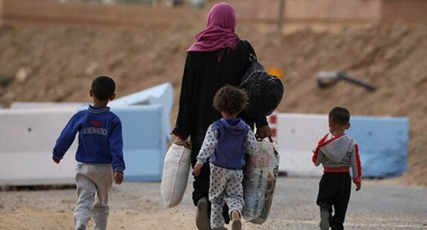 A woman with children in Syria. Photo: REUTERS/ Rodi Said A woman with children in Syria. Photo: REUTERS/ Rodi Said