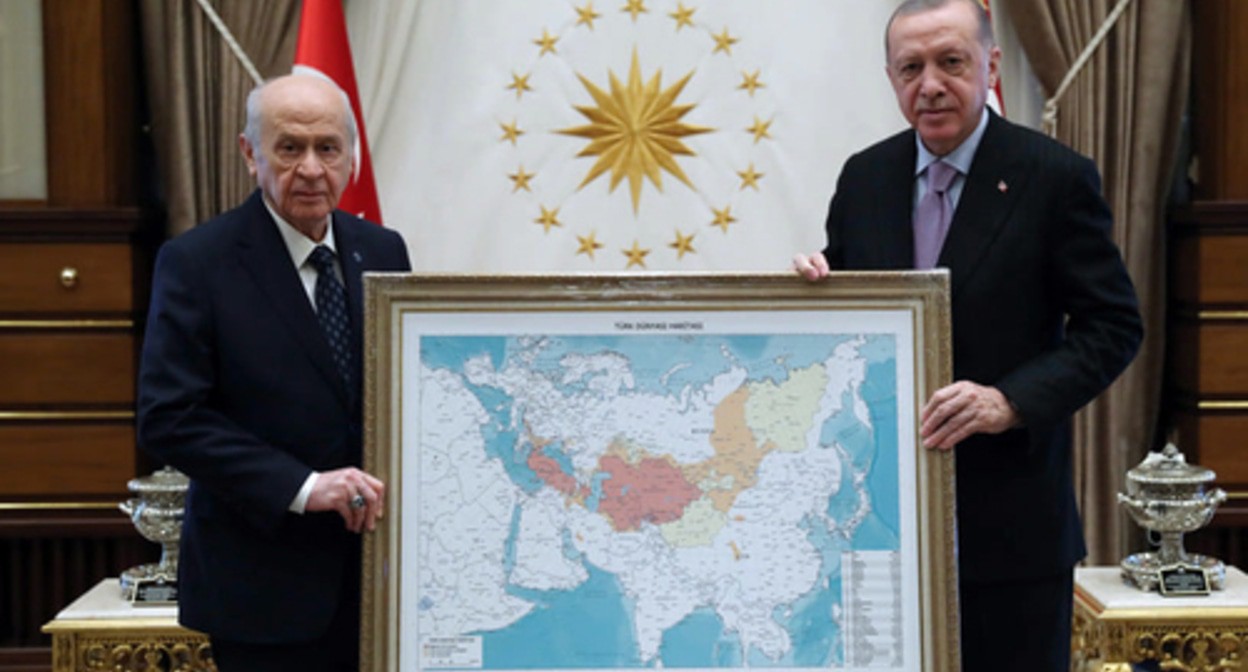 Devlet Bakhcheli and the President, Recep Tayyip Erdogan, with a map of the "Turkic World". Photo: Milliyetçi Hareket Partisi (MHP) / Facebook Devlet Bakhcheli and the President, Recep Tayyip Erdogan, with a map of the "Turkic World". Photo: Milliyetçi Hareket Partisi (MHP) / Facebook