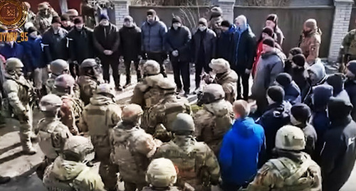 Screenshot of a video of the conversation of Chechen law enforcers with residents of a Ukrainian dwelling settlement https://vk.com/ramzan?w=wall279938622_751475 Screenshot of a video of the conversation of Chechen law enforcers with residents of a Ukrainian dwelling settlement https://vk.com/ramzan?w=wall279938622_751475