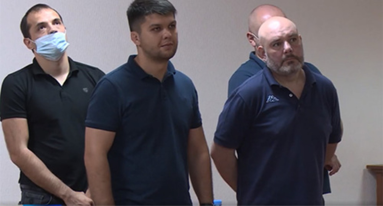 The policemen convicted in the case on Tskaev’s death in the courtroom. Screenshot of the video by the Russian TV channel https://alaniatv.ru/verhovnyj-sud-rso-a-smyagchil-prigovory-shesti-osuzhdyonnym-po-delu-tskaeva/ The policemen convicted in the case on Tskaev’s death in the courtroom. Screenshot of the video by the Russian TV channel https://alaniatv.ru/verhovnyj-sud-rso-a-smyagchil-prigovory-shesti-osuzhdyonnym-po-delu-tskaeva/