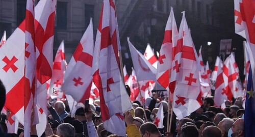Residents of Georgia with the country's flags at a protest action. Photo by Inna Kukudzhanova, the "Caucasian Knot" correspondent, at the rally in Tbilisi on October 14, 2021 Residents of Georgia with the country's flags at a protest action. Photo by Inna Kukudzhanova, the "Caucasian Knot" correspondent, at the rally in Tbilisi on October 14, 2021