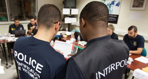 The police and Interpol officers. Photo by the Interpol's press office https://www.interpol.int/News-and-Events The police and Interpol officers. Photo by the Interpol's press office https://www.interpol.int/News-and-Events