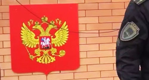 Coat of arms of Russia at awarding of Adam Kadyrov: screenshot of the video from the Telegram channel Kadyrov_95