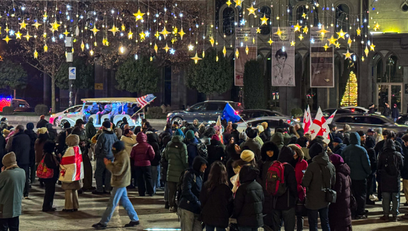Protesters outside the Georgian parliament on the 393rd day of protests. Screenshot from a Publica photo from December 25, 2025, https://www.facebook.com/photo?fbid=1638689560863921&set=a.715406393192247 (Meta, the company that owns the social network, is banned in Russia).