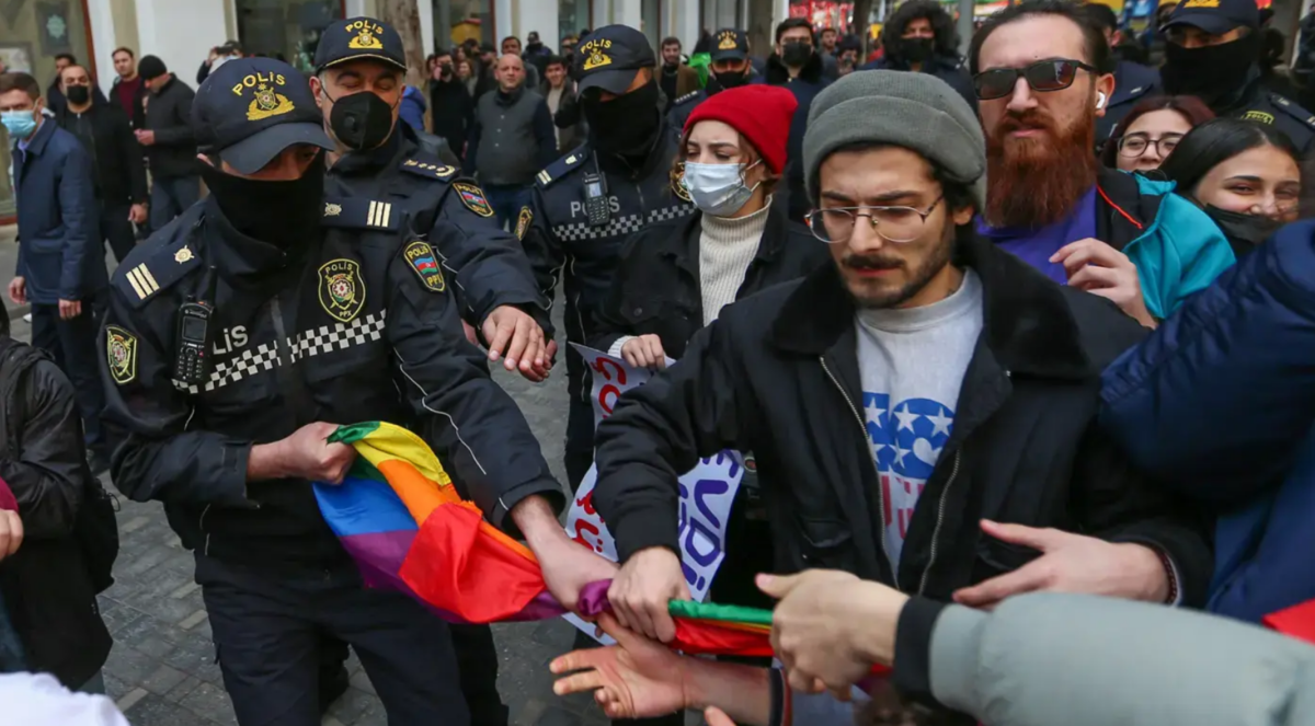 Police officers confiscate an LGBT flag from a protester. Baku, March 2022. Photo by Aziz Karimov for the "Caucasian Knot"