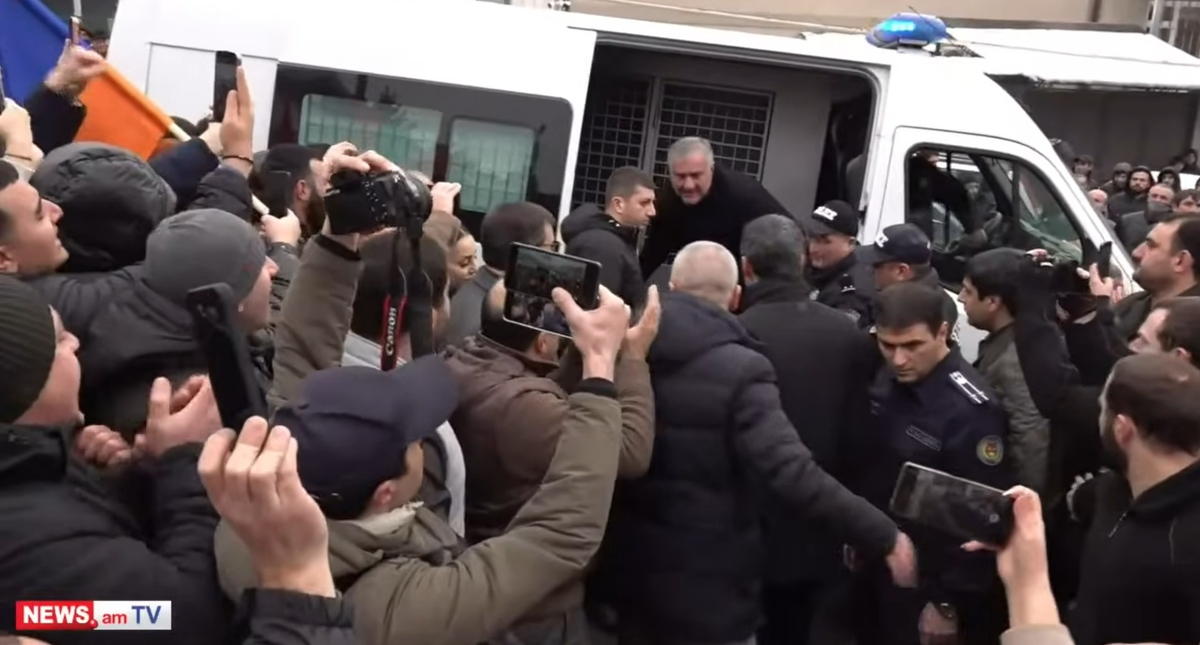 Samvel Karapetyan exits a police van. Yerevan, January 18, 2026. Still from News.am video https://www.youtube.com/watch?v=qc_cOl-QTmg