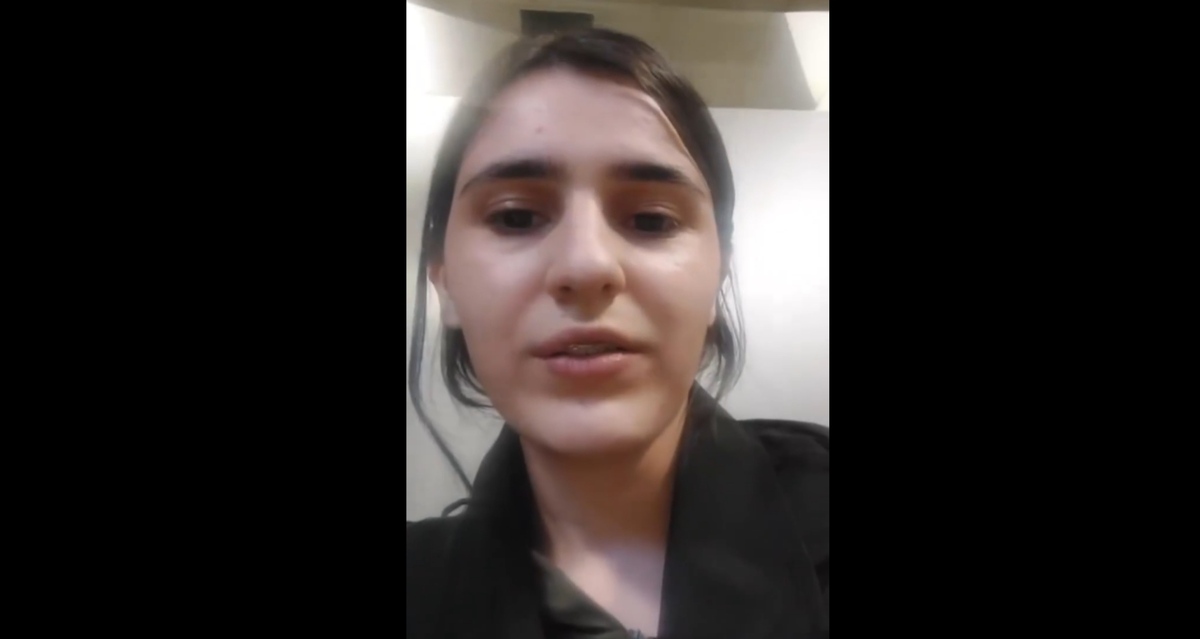 A still from Aishat Khizrieva's video message about leaving Russia: https://t.me/marem_group/1658