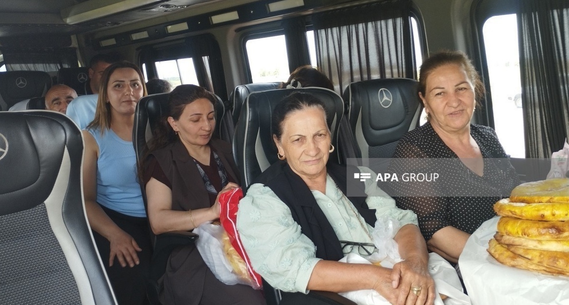 Former internally displaced persons. May 16, 2026. Photo: APA https://ru.apa.az/sotsium/gruppy-pereselencev-pribyli-v-ryad-sel-xodzalinskogo-raiona-foto-obnovleno-651473