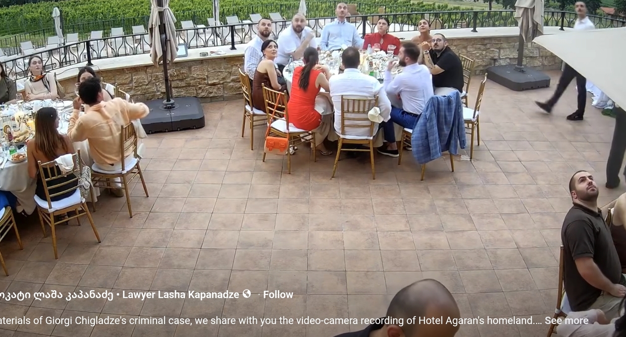 Wedding participants look up after the shouts from the balcony. Screenshot from Lasha Kapanadze's publication. Wedding participants look up after the shouts from the balcony. Screenshot from Lasha Kapanadze's publication.
