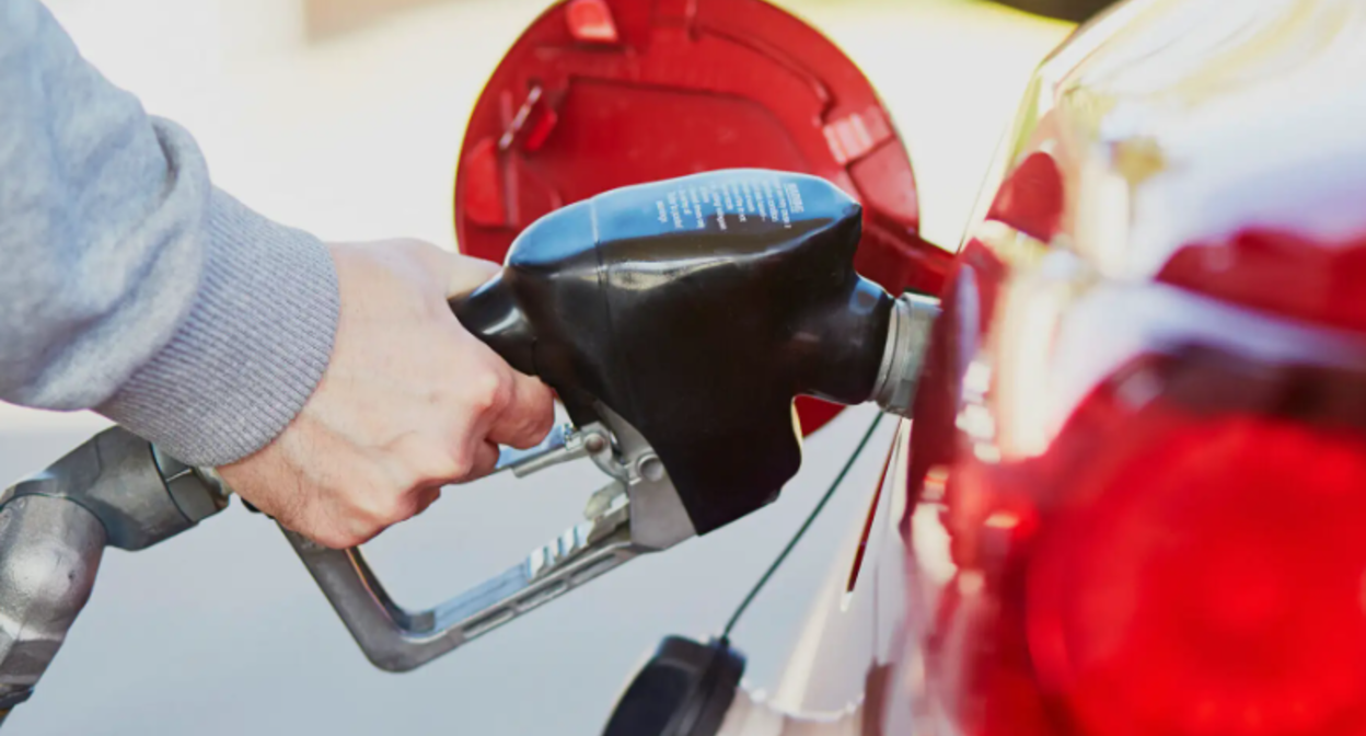 Filling up a car. Screenshot from photo https://www.torquedetail.com/blogs/car-detailing/the-top-6-paint-enemies-to-eliminate-fast?utm_medium=organic&utm_source=yandexsmartcamera.